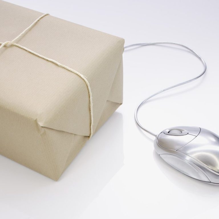 Glass mouse leading from a wrapped parcel